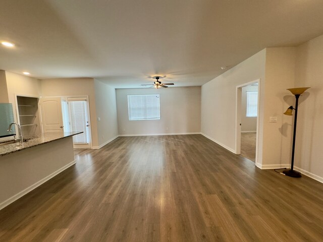 336 Oliver Way, Baxter, TN 38544 - unfurnished living room featuring dark wood finished floors, a ceiling fan, baseboards, recessed lighting, and a sink