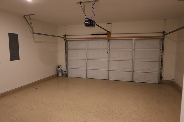 336 Oliver Way, Baxter, TN 38544 - garage featuring electric panel, a garage door opener, and baseboards