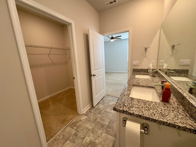 336 Oliver Way, Baxter, TN 38544 - full bathroom with a spacious closet, double vanity, ceiling fan, and baseboards