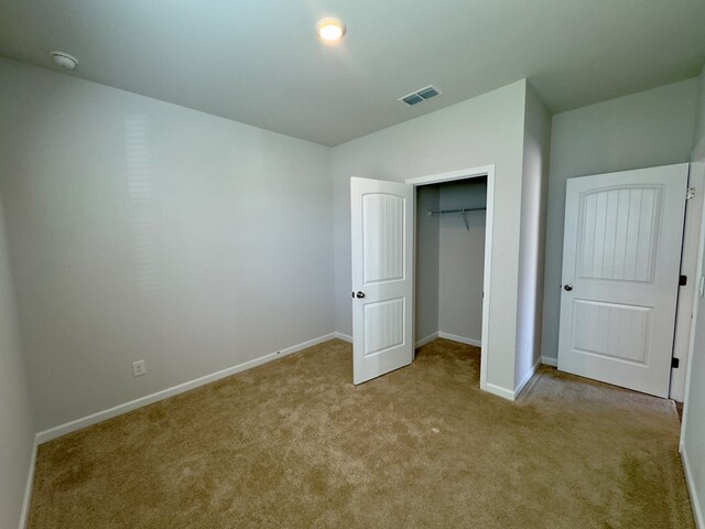 336 Oliver Way, Baxter, TN 38544 - unfurnished bedroom with carpet flooring, baseboards, and a closet