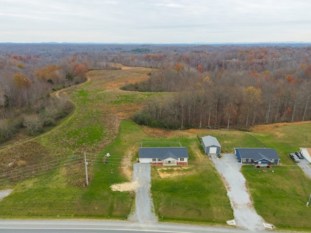 bird's eye view with a rural view and a view of trees