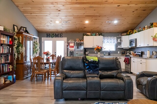 living room featuring light wood-style floors, wood ceiling, vaulted ceiling, and french doors