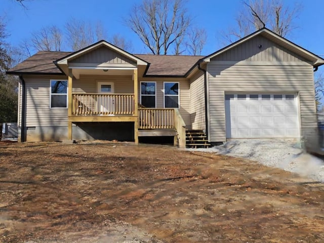 single story home featuring a garage, covered porch, and crawl space