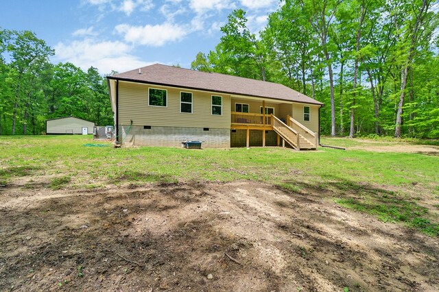 98 Paso Fino Trl, Jamestown, TN 38556 - back of property with crawl space, stairs, a lawn, and a deck