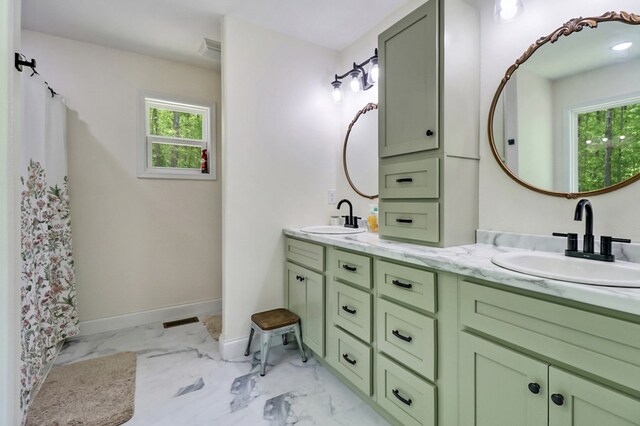 98 Paso Fino Trl, Jamestown, TN 38556 - bathroom featuring double vanity, marble finish floors, and baseboards