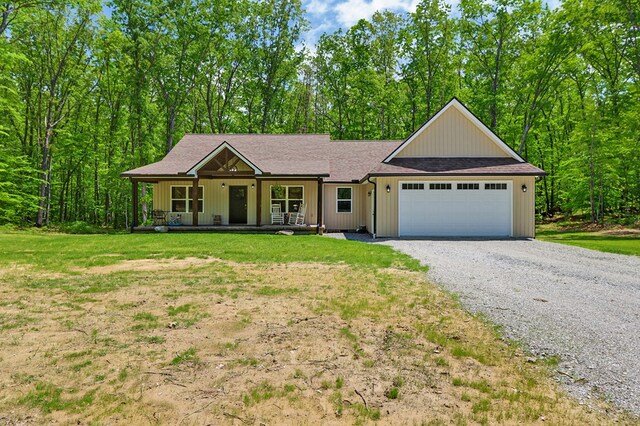 98 Paso Fino Trl, Jamestown, TN 38556 - single story home featuring a porch, an attached garage, gravel driveway, and a front yard