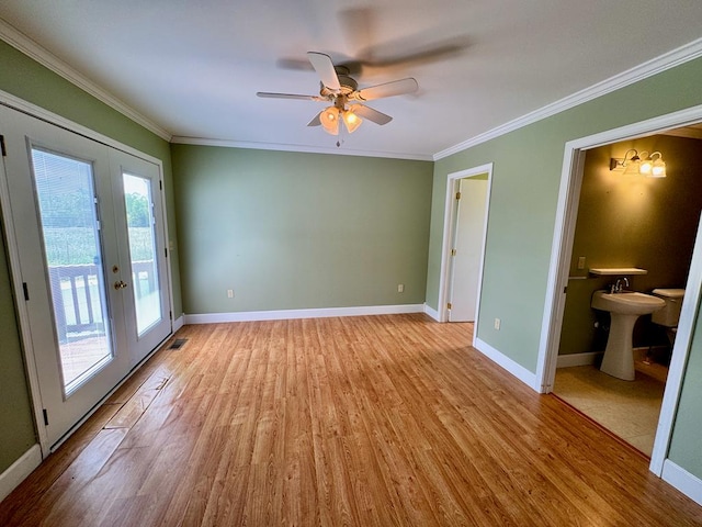1039 Old Martha Washington Rd, Clarkrange, TN 38553 - unfurnished room featuring french doors, light wood finished floors, crown molding, and a ceiling fan