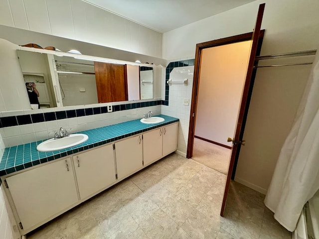 1039 Old Martha Washington Rd, Clarkrange, TN 38553 - bathroom with double vanity, a shower, and backsplash