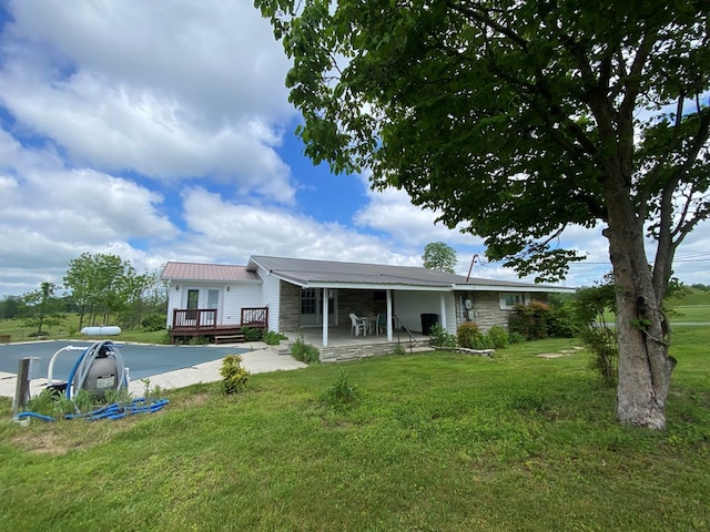 1039 Old Martha Washington Rd, Clarkrange, TN 38553 - back of house with stone siding, a deck, a yard, and a patio