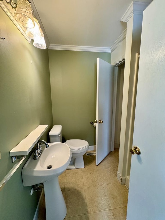 1039 Old Martha Washington Rd, Clarkrange, TN 38553 - half bath with ornamental molding and tile patterned flooring