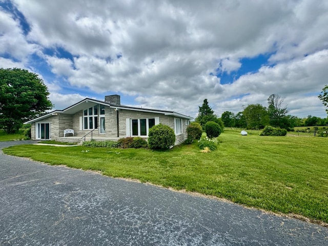 1039 Old Martha Washington Rd, Clarkrange, TN 38553 - view of front of property featuring a chimney, stone siding, and a front yard