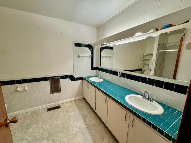 1039 Old Martha Washington Rd, Clarkrange, TN 38553 - bathroom with tile walls, a stall shower, and double vanity