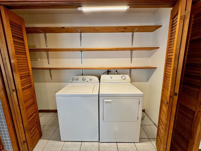 1039 Old Martha Washington Rd, Clarkrange, TN 38553 - laundry area with washing machine and clothes dryer and light tile patterned floors