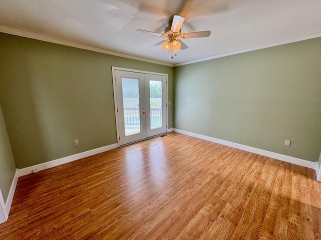 1039 Old Martha Washington Rd, Clarkrange, TN 38553 - spare room featuring french doors, light wood finished floors, ornamental molding, and a ceiling fan