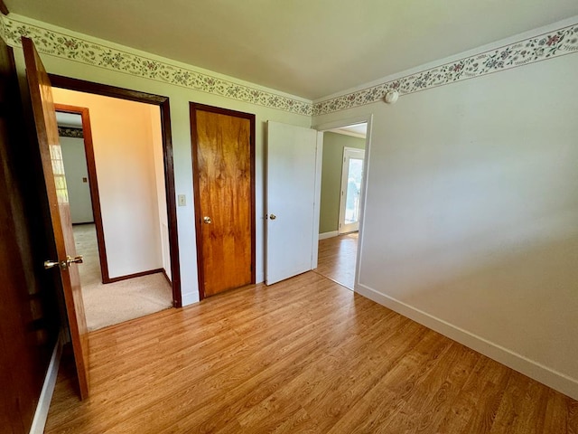 1039 Old Martha Washington Rd, Clarkrange, TN 38553 - unfurnished bedroom featuring light wood-style floors