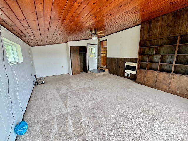 1039 Old Martha Washington Rd, Clarkrange, TN 38553 - unfurnished living room with heating unit, wooden ceiling, carpet flooring, wood walls, and lofted ceiling