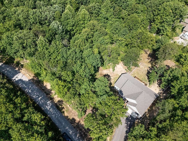 birds eye view of property with a wooded view