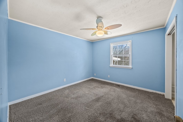 unfurnished bedroom with baseboards, visible vents, a textured ceiling, and carpet