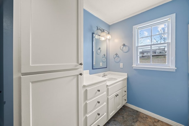 bathroom with vanity, baseboards, and ornamental molding