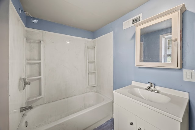 bathroom with vanity, bathing tub / shower combination, and visible vents