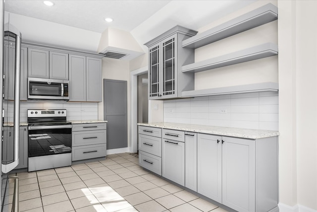 kitchen with stainless steel appliances, open shelves, gray cabinets, and visible vents