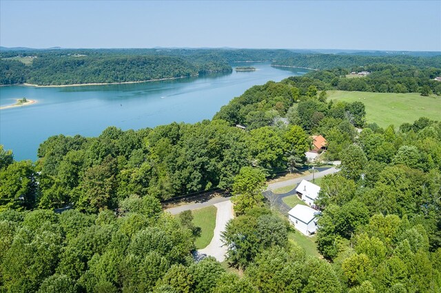 bird's eye view featuring a view of trees and a water view