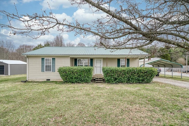 ranch-style home with entry steps, metal roof, crawl space, a front lawn, and a carport