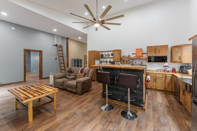 294 Big Piney Loop, Wilder, TN 38589 - living area with a high ceiling, a ceiling fan, dark wood-type flooring, and recessed lighting