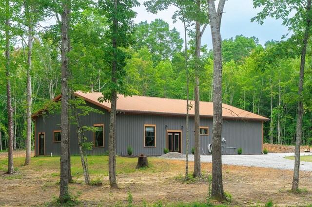 294 Big Piney Loop, Wilder, TN 38589 - rear view of property featuring metal roof and gravel driveway