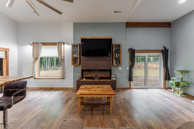 294 Big Piney Loop, Wilder, TN 38589 - living area with wood finished floors, baseboards, a brick fireplace, and ceiling fan