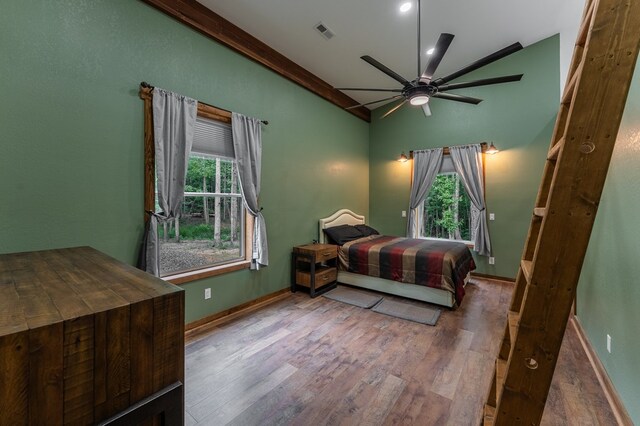 294 Big Piney Loop, Wilder, TN 38589 - bedroom with vaulted ceiling, wood finished floors, multiple windows, a ceiling fan, and baseboards