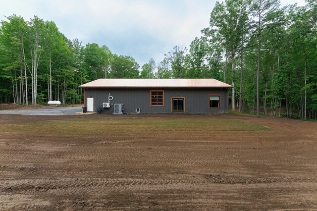 294 Big Piney Loop, Wilder, TN 38589 - view of home's exterior featuring central AC and metal roof