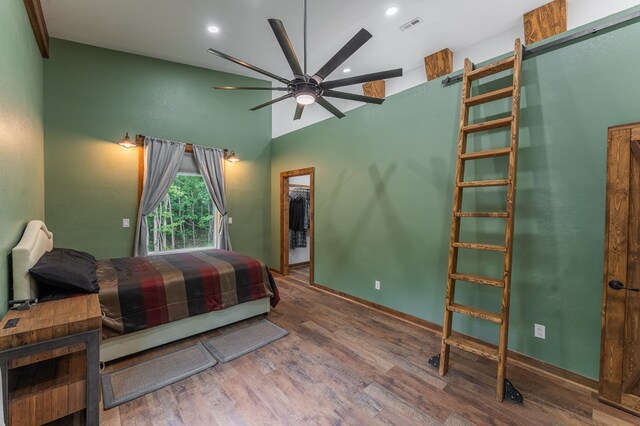294 Big Piney Loop, Wilder, TN 38589 - bedroom with wood finished floors, a spacious closet, recessed lighting, baseboards, and high vaulted ceiling