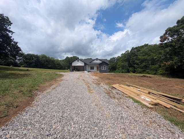 249 Old Grimsley Ct, Grimsley, TN 38565 - view of front of house featuring gravel driveway and a garage