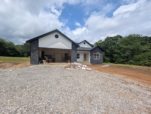 249 Old Grimsley Ct, Grimsley, TN 38565 - view of front of home with driveway, an attached garage, and stone siding