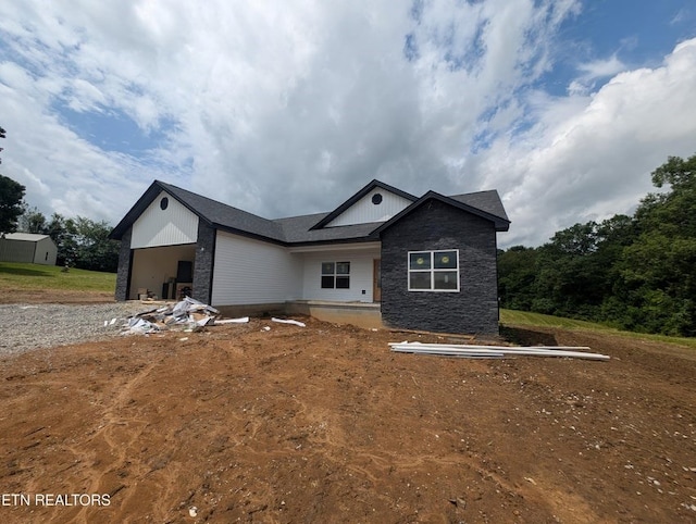 249 Old Grimsley Ct, Grimsley, TN 38565 - view of front of house with stone siding, a garage, and board and batten siding