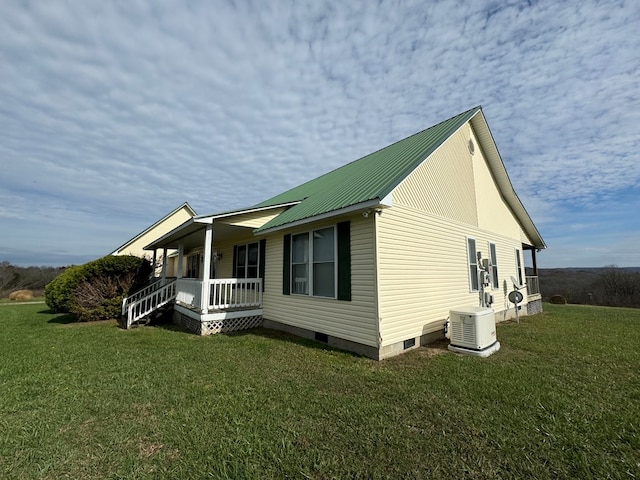1032 Kendall Smith Rd, Pikeville, TN 37367 - view of property exterior featuring a porch, a lawn, and a metal roof