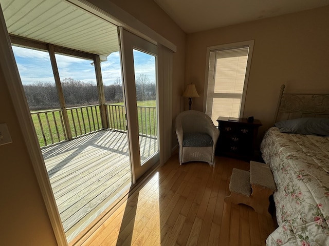 1032 Kendall Smith Rd, Pikeville, TN 37367 - bedroom with access to exterior and hardwood / wood-style floors