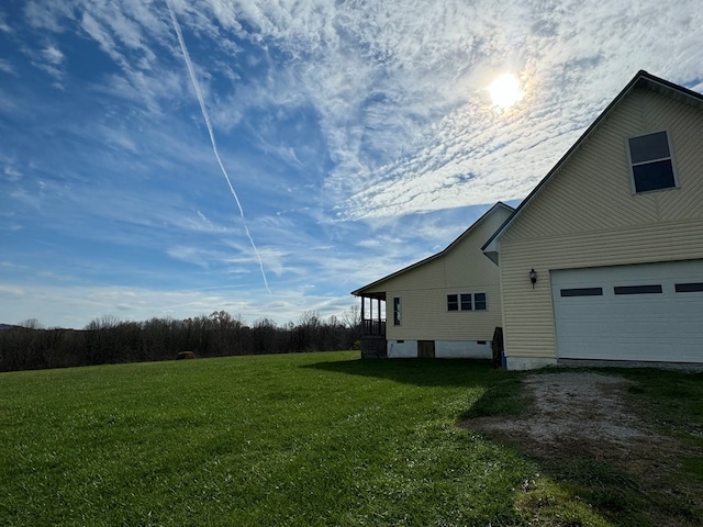 1032 Kendall Smith Rd, Pikeville, TN 37367 - view of side of home with a garage, a lawn, and driveway