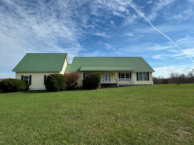 1032 Kendall Smith Rd, Pikeville, TN 37367 - view of front of property with a porch, a metal roof, and a front lawn
