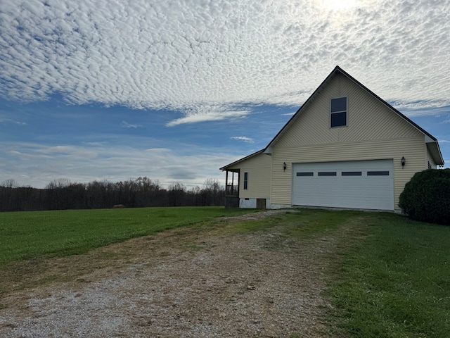 1032 Kendall Smith Rd, Pikeville, TN 37367 - view of side of home featuring driveway, a garage, and a yard
