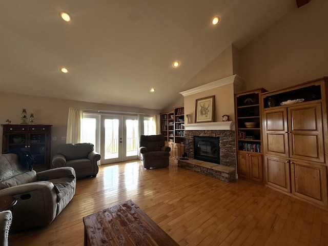 1032 Kendall Smith Rd, Pikeville, TN 37367 - living room featuring light wood-style flooring, a fireplace, high vaulted ceiling, and recessed lighting