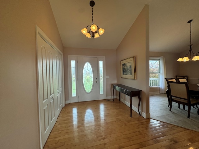 1032 Kendall Smith Rd, Pikeville, TN 37367 - foyer entrance featuring a chandelier, lofted ceiling, and light wood finished floors