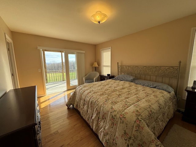 1032 Kendall Smith Rd, Pikeville, TN 37367 - bedroom with wood-type flooring and access to outside