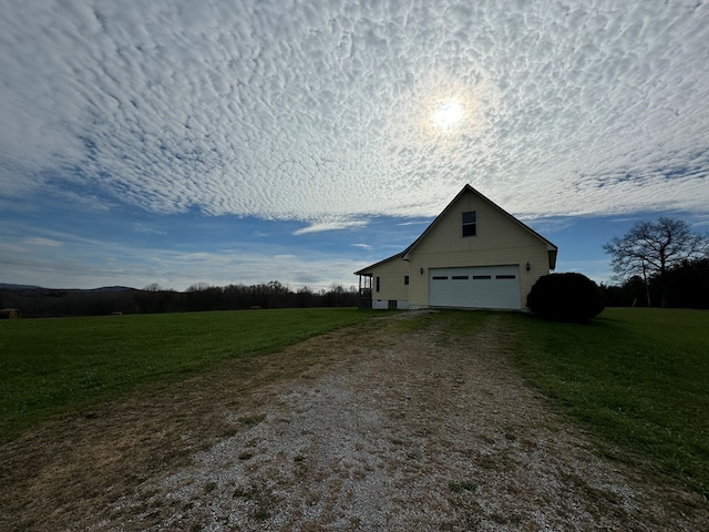 1032 Kendall Smith Rd, Pikeville, TN 37367 - view of property exterior with a garage, a lawn, driveway, and an outdoor structure