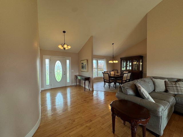 1032 Kendall Smith Rd, Pikeville, TN 37367 - living room with a chandelier, wood-type flooring, and high vaulted ceiling