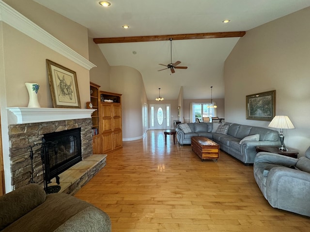 1032 Kendall Smith Rd, Pikeville, TN 37367 - living room featuring ceiling fan, light wood-type flooring, a fireplace, beamed ceiling, and high vaulted ceiling
