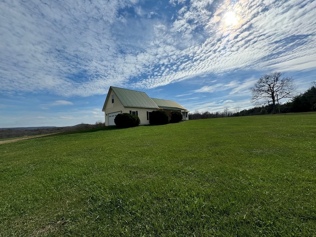 1032 Kendall Smith Rd, Pikeville, TN 37367 - view of green lawn featuring a garage, an outdoor structure, and a pole building