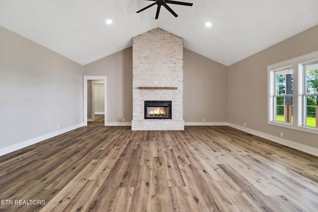 320 Ridge Ln, Monterey, TN 38574 - unfurnished living room with ceiling fan, vaulted ceiling, wood finished floors, a fireplace, and recessed lighting