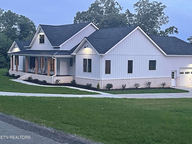 320 Ridge Ln, Monterey, TN 38574 - modern inspired farmhouse featuring a porch, a standing seam roof, a front lawn, and board and batten siding